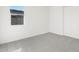 Bright bedroom with gray carpeting and a window at 37287 W Patterson St, Maricopa, AZ 85138