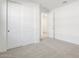 Bedroom with double-door closet and carpet at 37287 W Patterson St, Maricopa, AZ 85138