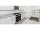 Kitchen with stainless steel appliances and granite countertops at 37287 W Patterson St, Maricopa, AZ 85138