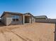 Single story home with desert landscape and covered patio at 37287 W Patterson St, Maricopa, AZ 85138