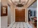 Elegant entryway with double doors and chandelier at 21062 N 76Th Ave, Glendale, AZ 85308