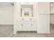 Double vanity bathroom with white cabinets and a large mirror at 4642 N 177Th Ln, Goodyear, AZ 85395