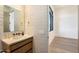 Contemporary half-bath with textured tile and floating vanity at 10249 E Joy Ranch Rd, Scottsdale, AZ 85262