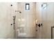 Sleek shower with glass enclosure and modern finishes at 10249 E Joy Ranch Rd, Scottsdale, AZ 85262