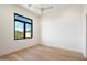 Bright bedroom with hardwood floors and large window at 10249 E Joy Ranch Rd, Scottsdale, AZ 85262