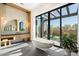 Spa-like bathroom with freestanding tub, large window, and modern vanity at 10249 E Joy Ranch Rd, Scottsdale, AZ 85262