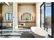 Elegant bathroom with a freestanding tub, modern vanity, and large mirror at 10249 E Joy Ranch Rd, Scottsdale, AZ 85262