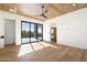 Light and airy bedroom with wood ceiling, sliding glass doors to patio, and hardwood floors at 10249 E Joy Ranch Rd, Scottsdale, AZ 85262