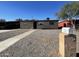 Ranch style home with carport and gravel driveway at 5036 S 36Th Ave, Phoenix, AZ 85041