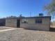 Ranch style home with carport and gravel driveway at 5036 S 36Th Ave, Phoenix, AZ 85041