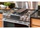 Stainless steel gas cooktop with integrated griddle at 13747 W Nogales Dr, Sun City West, AZ 85375