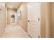 Hallway with tile floors and access to bathroom at 13747 W Nogales Dr, Sun City West, AZ 85375