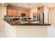 Modern kitchen with stainless steel appliances and granite countertops at 13747 W Nogales Dr, Sun City West, AZ 85375