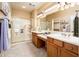 Double vanity bathroom with large shower and plenty of storage at 13747 W Nogales Dr, Sun City West, AZ 85375