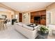 Living room with a comfortable couch and built-in shelving at 13747 W Nogales Dr, Sun City West, AZ 85375