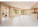 Open concept living area with tile floors and access to the backyard at 13747 W Nogales Dr, Sun City West, AZ 85375