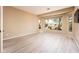 Light-filled bedroom with wood-look flooring at 13747 W Nogales Dr, Sun City West, AZ 85375