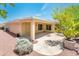 Home's back exterior and patio with desert landscaping at 13747 W Nogales Dr, Sun City West, AZ 85375