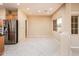 Bright dining area with tile flooring and view to backyard at 13747 W Nogales Dr, Sun City West, AZ 85375