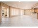 Open concept living area with tile floors and access to the backyard at 13747 W Nogales Dr, Sun City West, AZ 85375