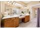Bathroom with double vanity and a large mirror at 13747 W Nogales Dr, Sun City West, AZ 85375