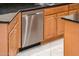 Stainless steel built-in dishwasher in a corner kitchen cabinet at 13747 W Nogales Dr, Sun City West, AZ 85375