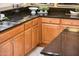 Well-maintained kitchen with light wood cabinets and granite countertops at 13747 W Nogales Dr, Sun City West, AZ 85375