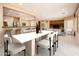 Open dining area with modern table and chairs, near kitchen at 13747 W Nogales Dr, Sun City West, AZ 85375