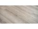Light brown wood-look plank flooring at 13747 W Nogales Dr, Sun City West, AZ 85375