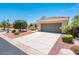 Single-story home with a two-car garage and nicely landscaped front yard at 13747 W Nogales Dr, Sun City West, AZ 85375