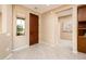 Bright entryway with tile flooring and access to other rooms at 13747 W Nogales Dr, Sun City West, AZ 85375