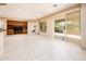 Bright Gathering room with tile floors and access to backyard patio at 13747 W Nogales Dr, Sun City West, AZ 85375