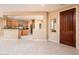 Open kitchen with island, stainless steel appliances, and wood cabinets at 13747 W Nogales Dr, Sun City West, AZ 85375