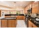 Well-equipped kitchen with stainless steel appliances and an island at 13747 W Nogales Dr, Sun City West, AZ 85375