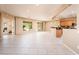 Bright and airy living area with tile flooring and access to backyard at 13747 W Nogales Dr, Sun City West, AZ 85375