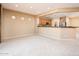 Kitchen with breakfast bar and view into Gathering room at 13747 W Nogales Dr, Sun City West, AZ 85375