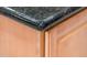 Close-up detail of a dark granite kitchen counter edge at 13747 W Nogales Dr, Sun City West, AZ 85375