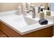 Bathroom vanity with single sink, modern faucet, and neutral decor at 13747 W Nogales Dr, Sun City West, AZ 85375