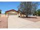 Single-story home with attached garage and landscaped front yard at 822 W Earll Dr, Phoenix, AZ 85013