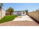 Artificial turf backyard with patio and block wall at 4120 N 105Th Dr, Phoenix, AZ 85037