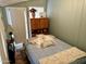 Bedroom with double bed and wood cabinet at 4065 E University Dr # 462, Mesa, AZ 85205