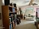 Living room with sofa, shelving, and artwork at 4065 E University Dr # 462, Mesa, AZ 85205