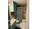 Bathroom with teal vanity and bathtub at 4065 E University Dr # 462, Mesa, AZ 85205