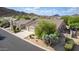 Aerial view of house with two-car garage and desert landscaping at 7358 E Red Hawk St, Mesa, AZ 85207