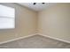 Empty bedroom with neutral walls, carpet, and double door closet at 19731 N Ben Ct, Maricopa, AZ 85138