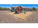 Backyard with playset and gravel ground cover at 19731 N Ben Ct, Maricopa, AZ 85138
