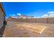 Backyard with gravel, block wall, and small patio at 19731 N Ben Ct, Maricopa, AZ 85138