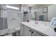 Clean bathroom with a shower/tub combo, white vanity, and gray floors at 19731 N Ben Ct, Maricopa, AZ 85138