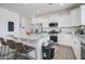 Bright kitchen with white cabinets, granite countertops and stainless steel appliances at 19731 N Ben Ct, Maricopa, AZ 85138