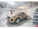 Garage with car, overhead storage, and wall shelving at 19731 N Ben Ct, Maricopa, AZ 85138